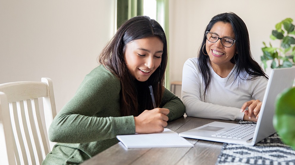 A mom and daughter going over college expenses.