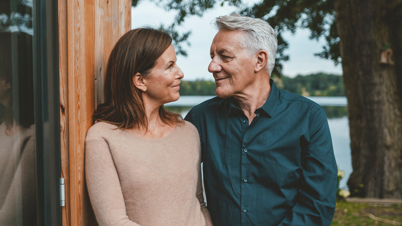 A mature couple looking lovingly at each other.